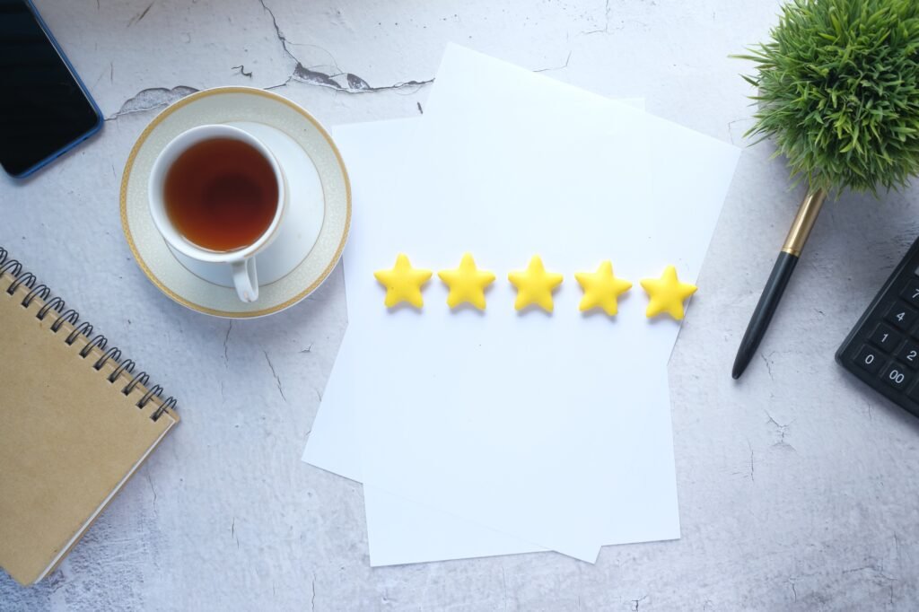 Customer review concept with Rating golden stars on table