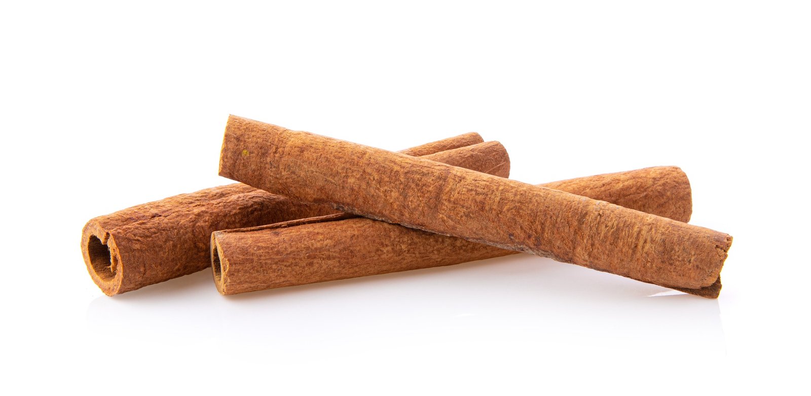 cinnamon sticks stacked on white
